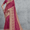 Magenta Banarasi soft silk saree with rich gold zari woven floral border and designer pallu, ideal for wedding, festive and party wear.