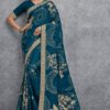 Teal blue Banarasi soft silk saree with gold zari woven floral and bird motifs, rich traditional border and designer pallu, perfect for wedding and festive wear.