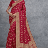 Elegant red Banarasi silk saree with intricate gold zari weaving, wide traditional border and richly detailed pallu, ideal for wedding, bridal and festive occasions.