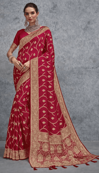Elegant red Banarasi silk saree with intricate gold zari weaving, wide traditional border and richly detailed pallu, ideal for wedding, bridal and festive occasions.