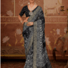 Woman wearing elegant black light weighted dola silk saree with intricate silver zari floral and traditional woven border, paired with matching blouse and statement silver jewelry in a heritage-themed setting.