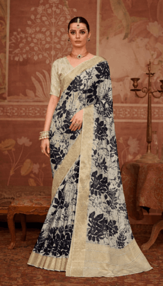 Model wearing an ivory silk saree with bold black floral prints and gold zari border.