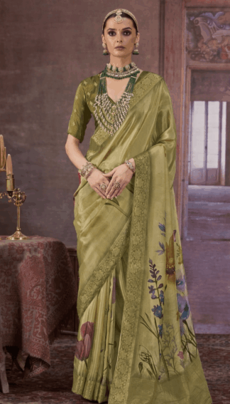 olive green Chinon silk saree with floral digital print and rich woven border, styled with traditional jewelry, perfect for festive and wedding occasions.