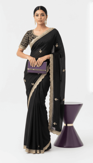 Black saree with embroidered border and small embroidered motifs with stiched heavy blouse.