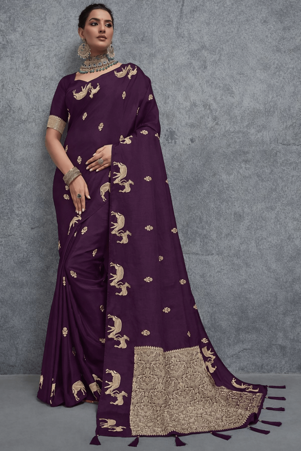 Elegant wine purple Banarasi silk saree with intricate golden zari woven motifs and rich traditional border, perfect for wedding, festive and party wear occasions.
