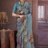 Sky blue silk saree with gold zari woven border and artistic abstract prints on the drape and pallu.